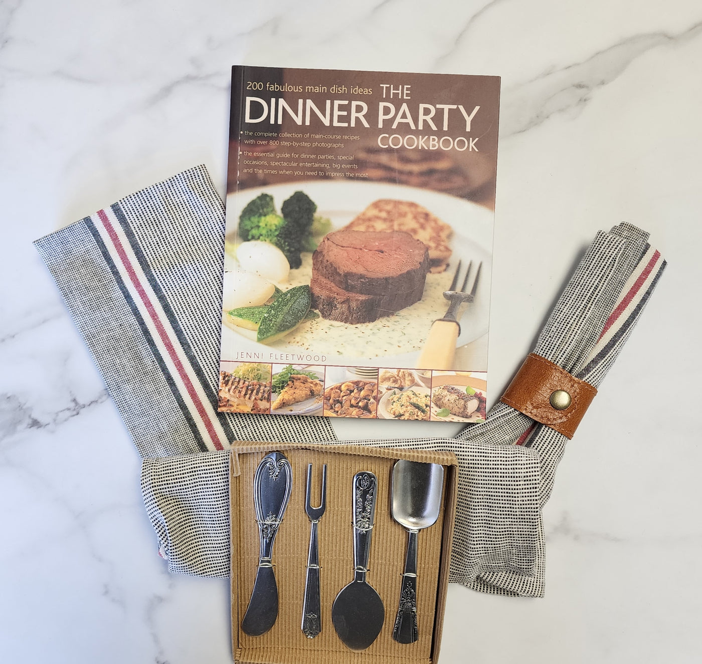 Dinner party cookbook, cotton chambray, leather napkin ring and cheese servers set