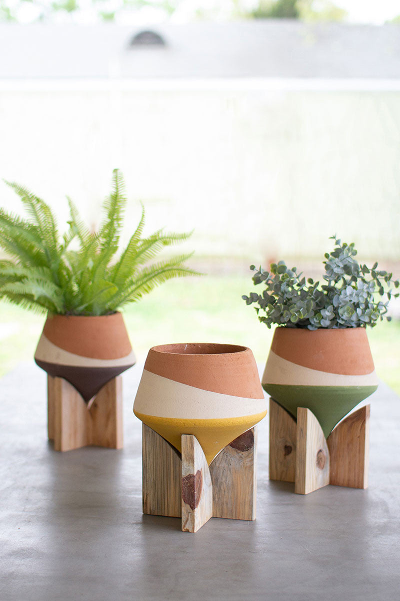 SET OF THREE DOUBLE DIPPED CLAY VASES ON WOOD BASES